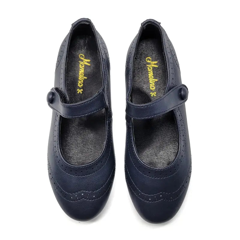 Pair of navy blue shoes with a brand logo on a white background