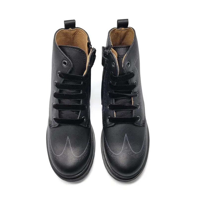 Pair of black leather boots on a white background