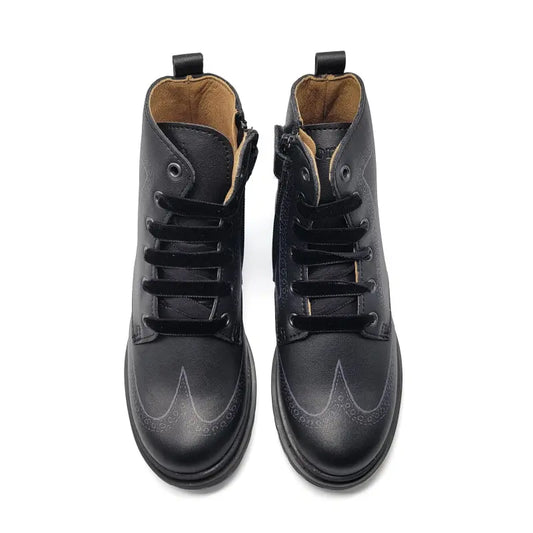 Pair of black leather boots on a white background